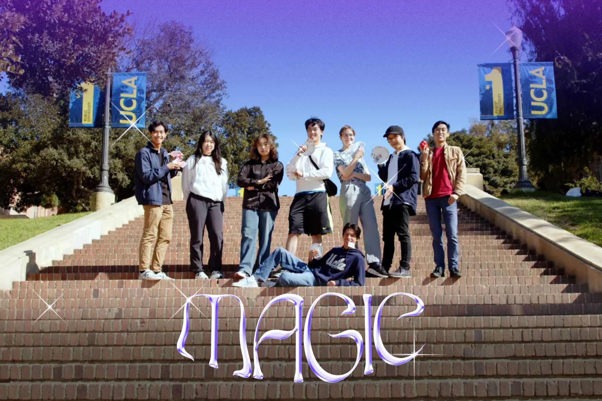 Eight of the members of the UCLA Magic and Student Illusion Team strike a mystical pose on Janss steps, surrounded by illustrated sparkles and the word &quot;MAGIC&quot;