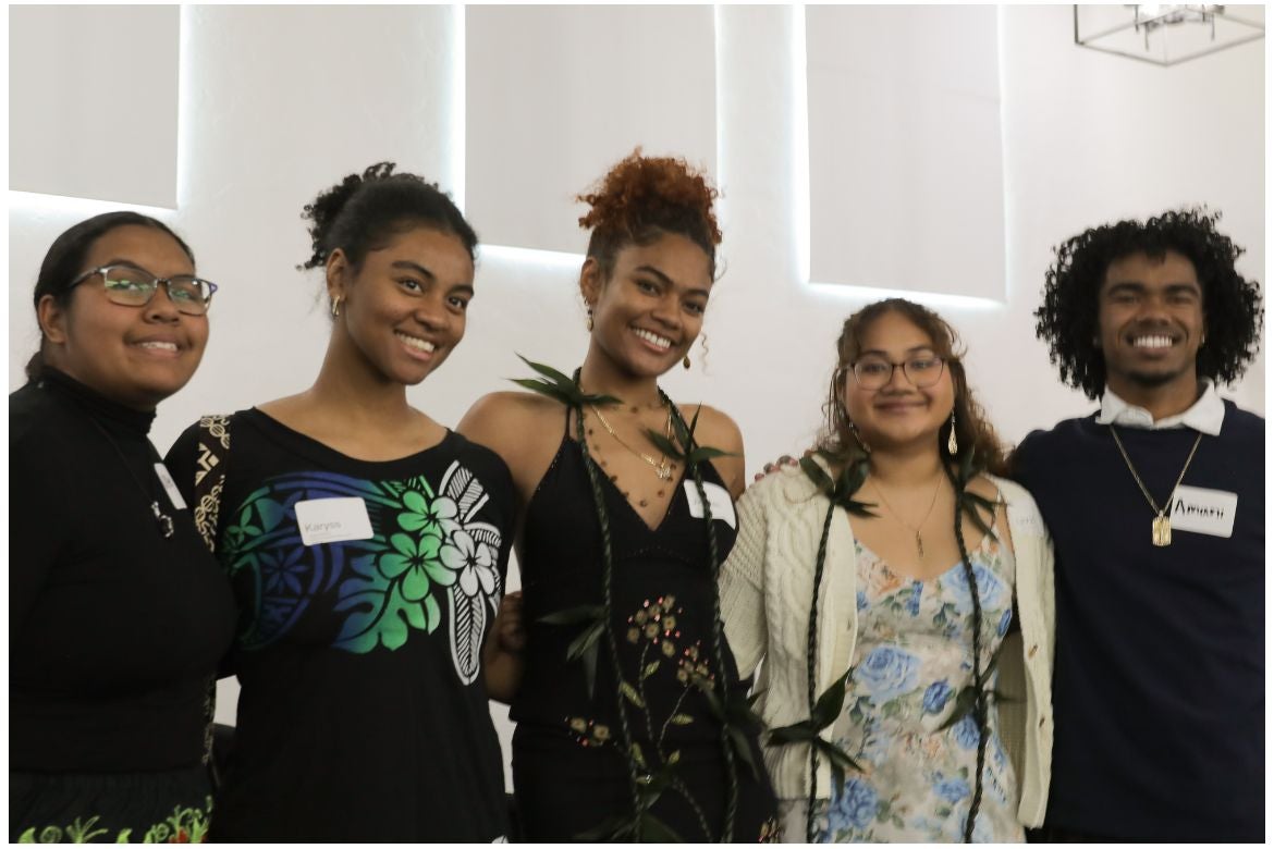 Five undergraduate students standing together