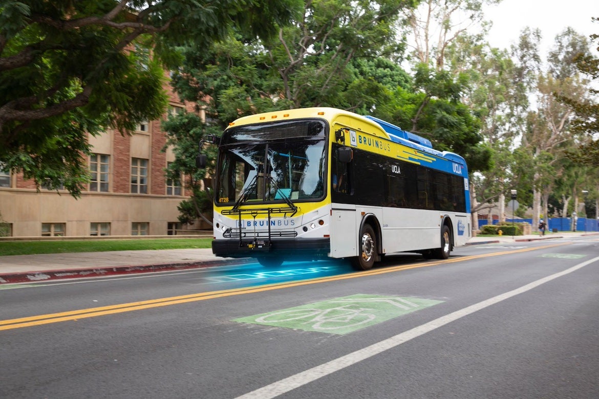 Artist rendering of a future in-road electric charging system underneath an electric BruinBus.