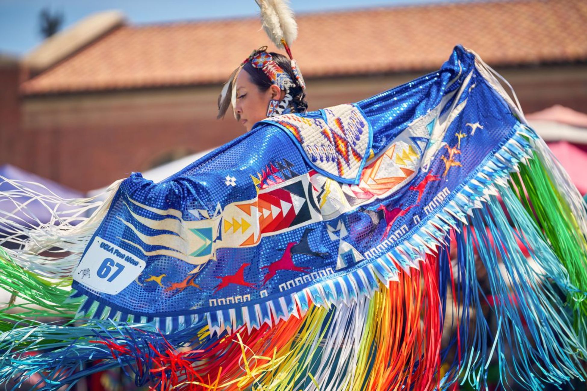 UCLA Pow Wow participant in vibrant Native regalia