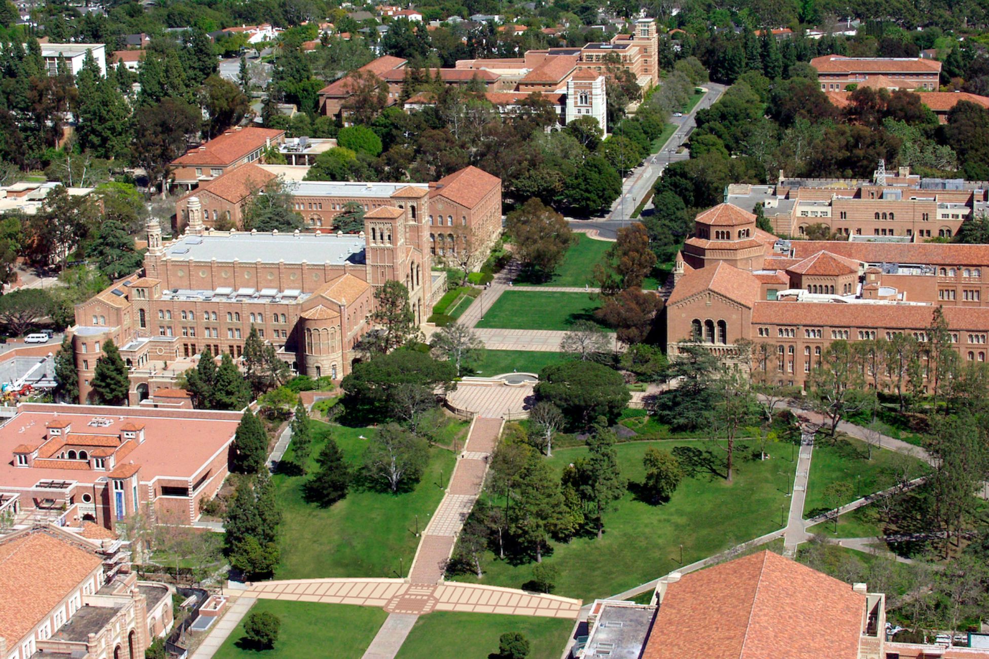 Aerial view of UCLA university campus with terracotta-roofed buildings and green lawns