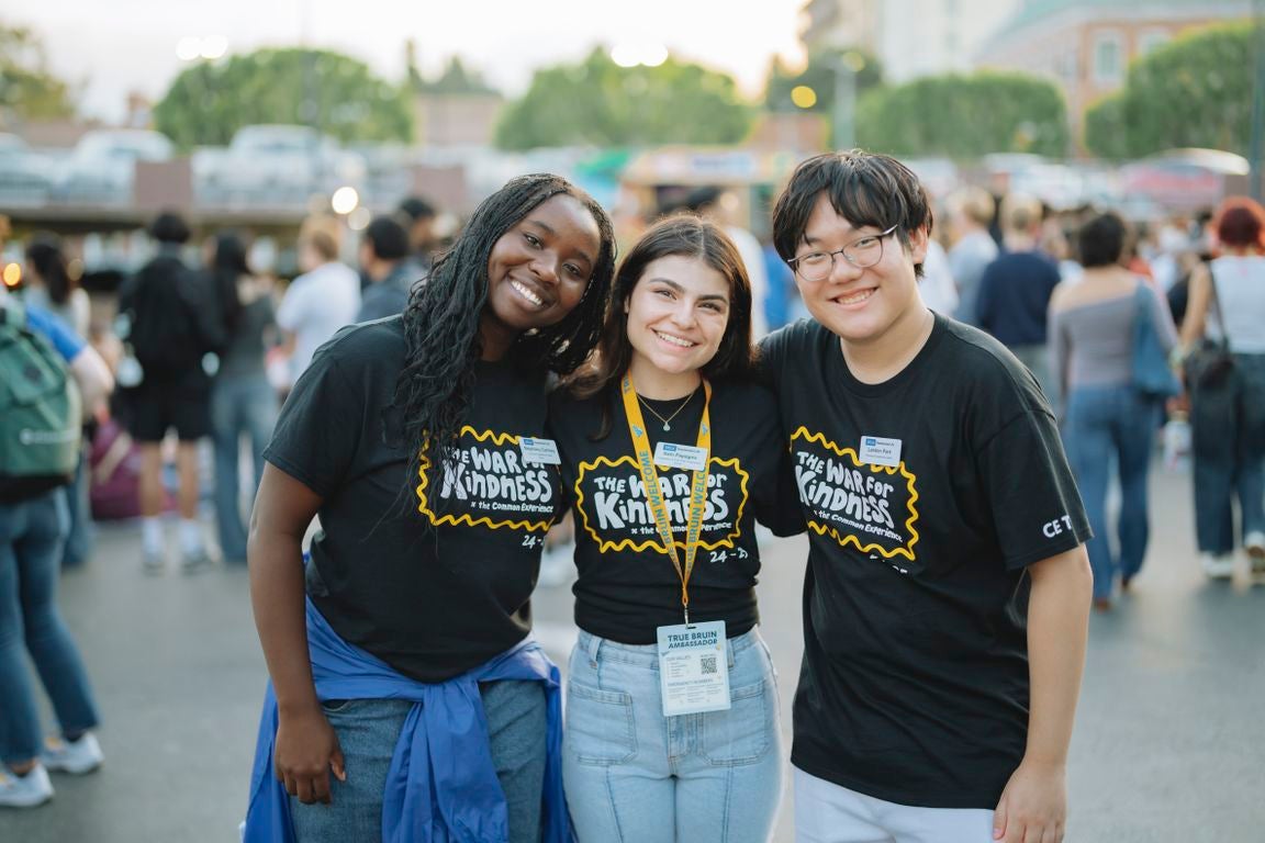 Students wearing black T-shirts with “The War for Kindness” on front