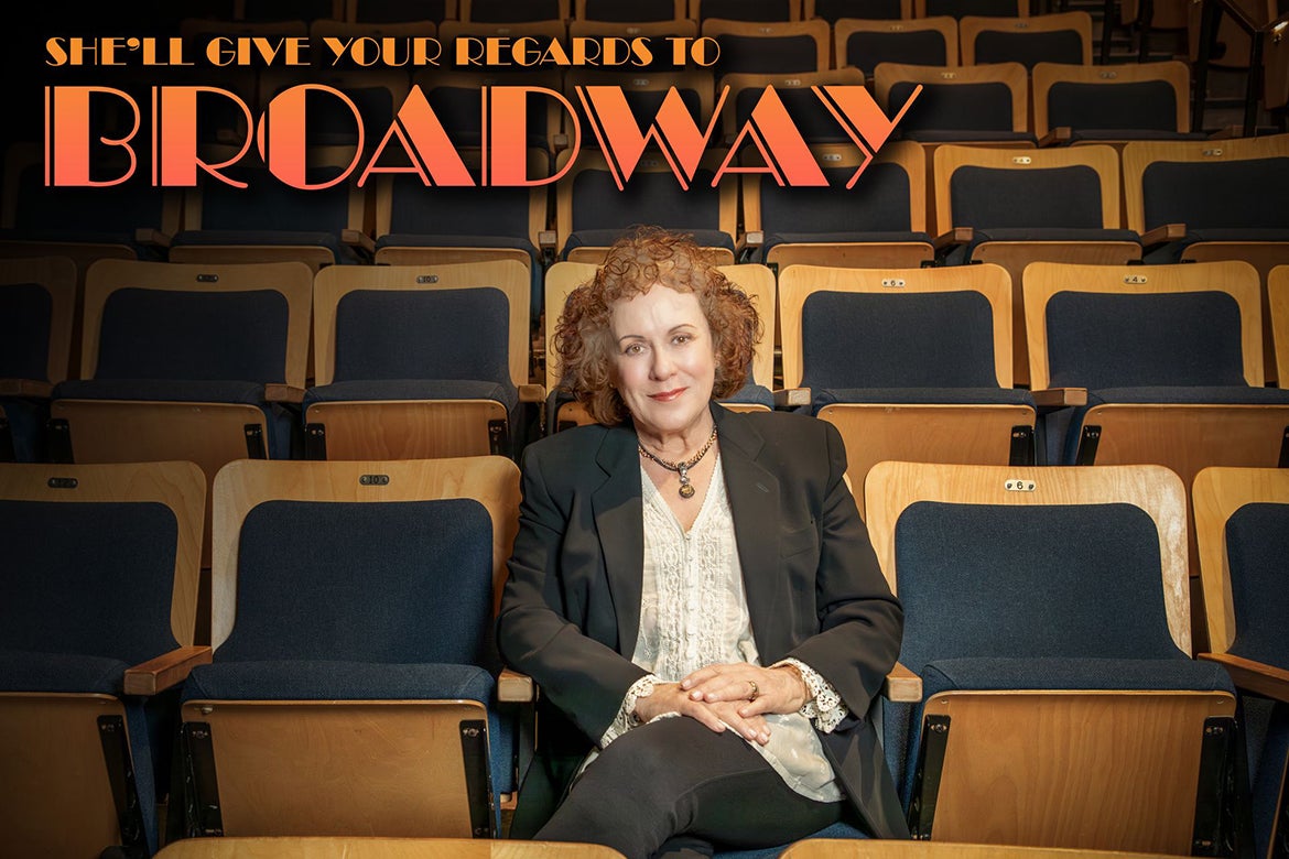 Judy Kaye sitting in a seat in an empty theater