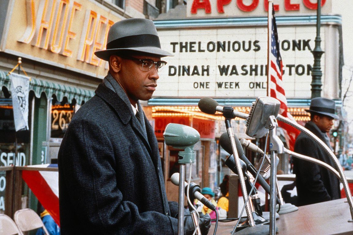 Denzel Washington near marquee with Thelonious Monk and Dinah Washington's names